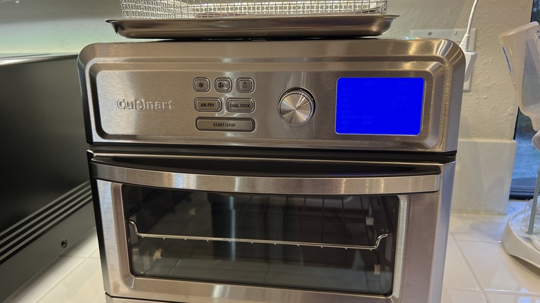 An air fryer with a silver exterior and a compact design Stock ...